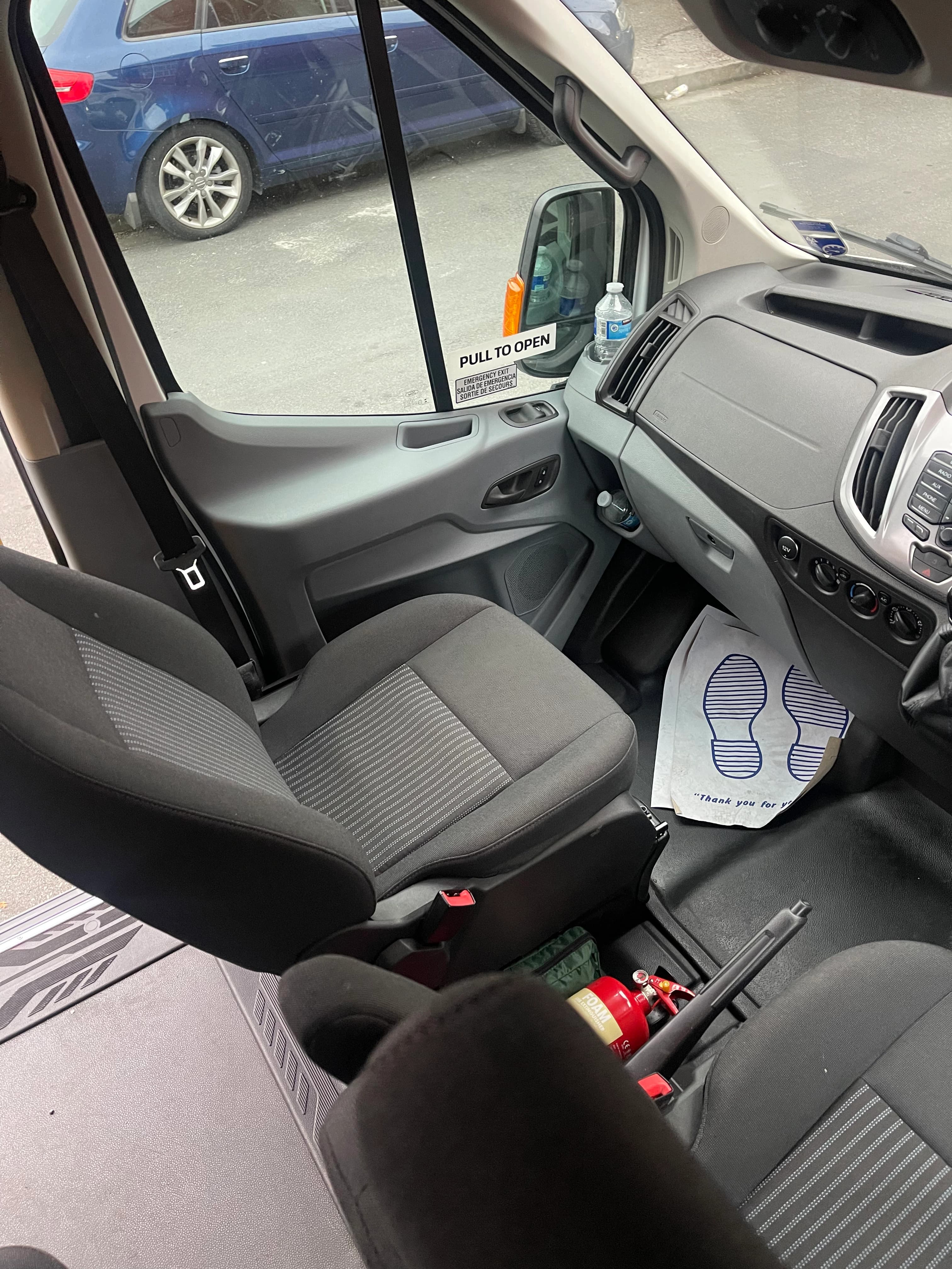Driver and front cabin of Ford Transit 2015 minibus