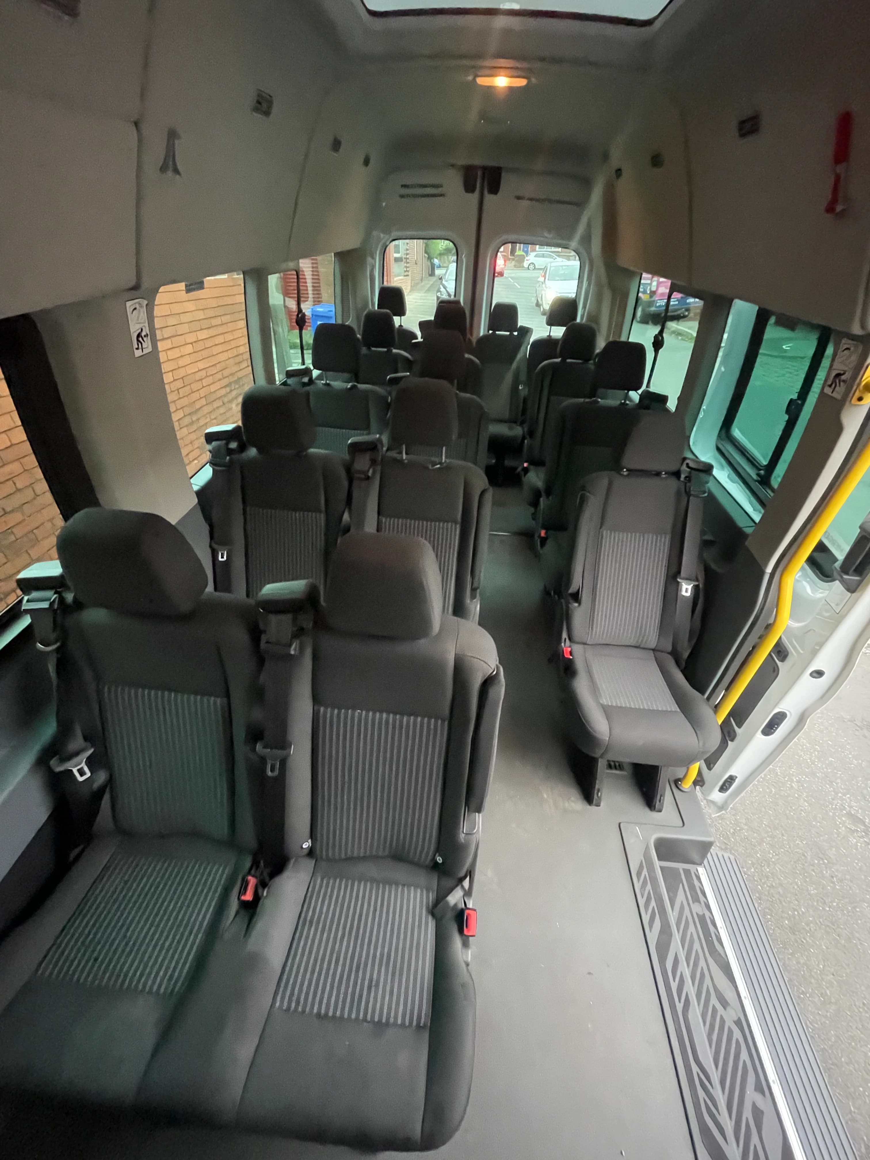 16-seater Ford Transit minibus interior seats with 3-point seat belts